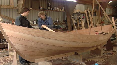 Fair Isle boat builder Ian Best and his son Tom work on one of the two yoals for the film Between Weathers - Photos: Liz Musser