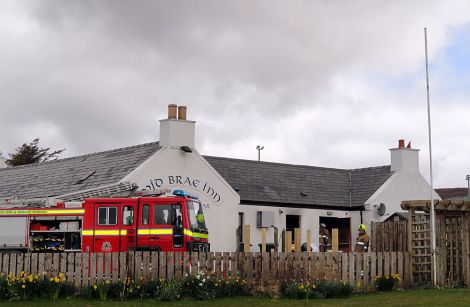 Fire fighters attending a fire at the Mid Brae Inn on Saturday morning - Photo: Shetland News