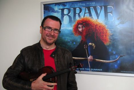 Shetland fiddle player, composer and producer Chris Stout is a featured soloist on the Disney Pixar blockbuster Brave which goes on release at Mareel from 10 September. Pic. Shetland Arts