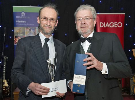 Company partner Pete Bevington (left) received the award from Scottish Government secretray for education and lifelong learning Mike Russell - Photo Ewen Weatherspoon