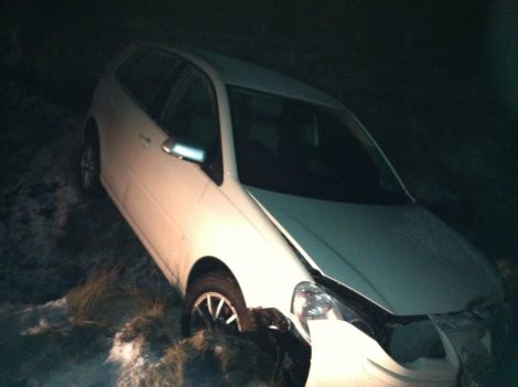A crashed VW Polo lies in a ditch near the Halfway House after coming off the road on Tuesday evening. Photo Shetland News