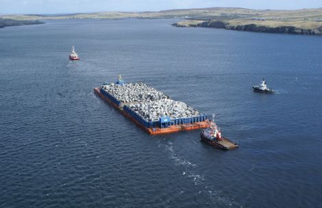 Kieran Murray's aerial shot shows Stema Barge 2 being towed into Lerwick harbour for shelter by the two Norwegian tugs Boa Balder and Afon Allow, escorted by the Lerwick harbour tug.