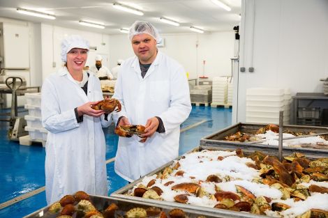 HIE’s Elaine Jamieson and Blueshell’s managing director Michael Laurenson sample some of the fresh crab delivered to the new plant. – Photo: John Coutts for HIE