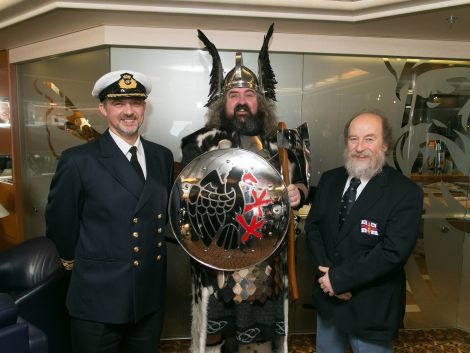 Lerwick lifeboat representative Brucie Leask (right) receives the Lerwick jarl squad plaque. Photo: Ben Mullay.