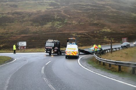 Police clearing a vehicle from the road following an accident at the Brig o Fitch junction in November 2011. Photo: Geoff Leask