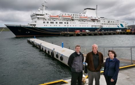 The temporary pontoon donated by Hjaltland Seafarms with (from left) deputy harbourmaster Alexander Simpson, Hjaltland managing director Sigurd Pettersen and port chief executive Sandra Laurenson. Photo LPA