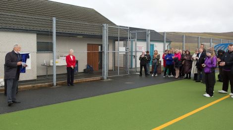 Shetland Recreational Trust chairman Joe Irvine speaking to the invited guests at the official opening of the Shetland Regional Hockey Centre on Saturday morning in Brae. Photo courtesy of SRT.