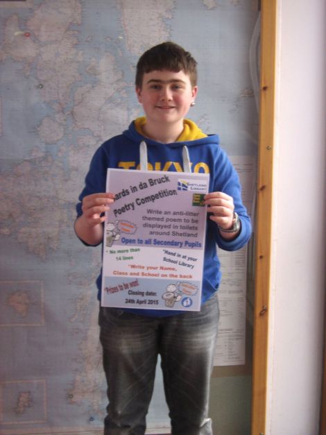 Alec Henry, a member of the Anderson High School Pupil Council, with the poster he designed for the competition.