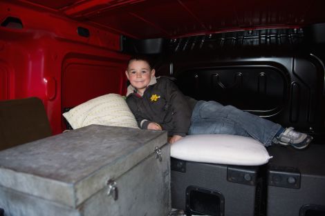 Five year old Bradley in the nest he made for himself in the back of his dad's disco van while the rest of Shetland was searching for him. Photo Malcolm Younger/Millgaet Media