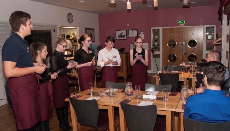 Now what was that order again? Sandwick junior high pupils take tips on how to take orders at Hay's Dock Café. Photo SAT