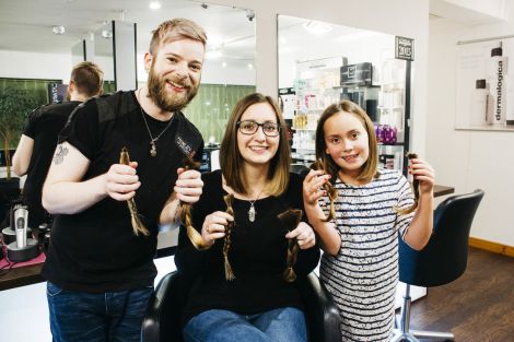 Jordan Kay and her aunt Krissi Macdonald proudly display their shorn locks with the man responsible Gary Stove from Sharp Image. Photos Ria Moncrieff