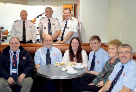 Enjoying the teas and home bakes are: (back row - left to right)) Hjaltland captain John Strathearn, hotel director Seamus Campbell, John Daly, purser; (front row - left to right): lifeboat mechanic Ian Harms, coxswain Bruce Leask, ladies' committee member Ann Marie Mullay, lifeboat crewman Ian Derbyshire, ladies' guild treasurer Rhoda Watt and lifeboat crewman Dieter Glaser - Photo: Jane Leask