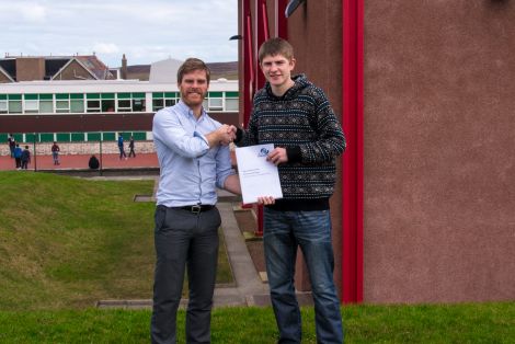 Dean Guthrie (right) receiving JLO Engineering's first ever scholarship from Joe Leask.