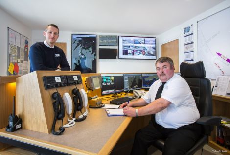 Deputy harbourmaster Alexander Simpson (left) and port controller Douglas Garrick appreciating the newly installed vessel monitoring system in the new port control room - Photo: John Coutts.