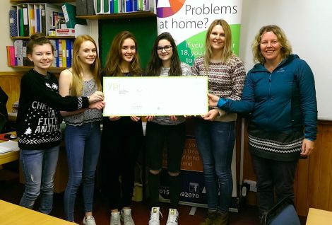 Presenting a cheque for £3,000 to Astryd Jamieson and Karen MacKelvin (right) are Anderson High School S3 pupils (l to r) Eilidh Johnson, Arwen Grieve, Eli Harvey and Jessica Irvine.