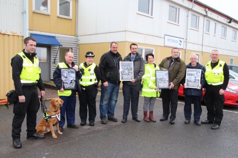 From left to right: Dogs Against Drugs' Ewan Anderson, JBT manager Tony Monaghan, constable Rachel Branney, Northwards' depot manager Robbie Leslie, detective constable Dayne McDonald, Streamline supervisor Lix Boxwell, detective inspector Richard Baird, DFDS director Hamish Balfour and Dogs Against Drugs' Michael Coutts. Photo: BBC Radio Shetland