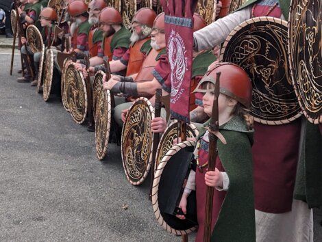 A group of people dressed as vikings.