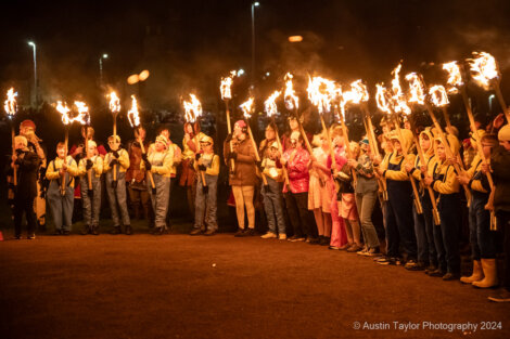 A group of people holding torches.