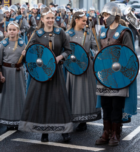 A group of people dressed in viking costumes.
